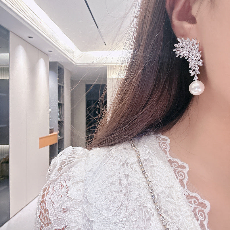 ZER20 - Imitation Pearl Inlaid Zirconia Earrings